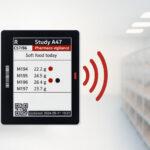 Digital cage card with LED indicator providing visual alerts in an animal research facility