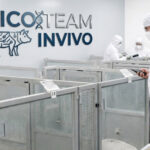 Picoteam InVivo digital solution in animal research facility with technicians using digital cage cards and mobile devices